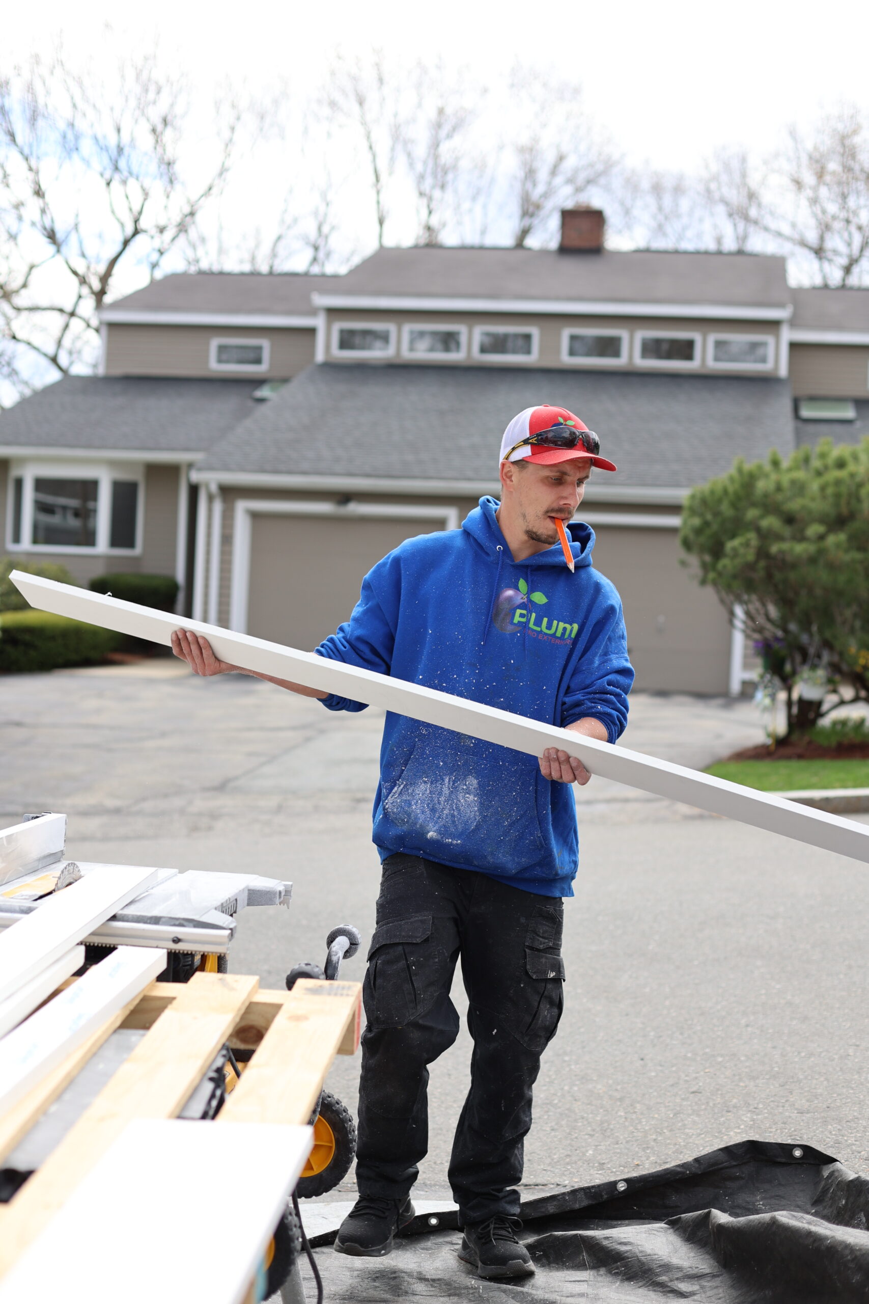 Installer carrying new trim boards