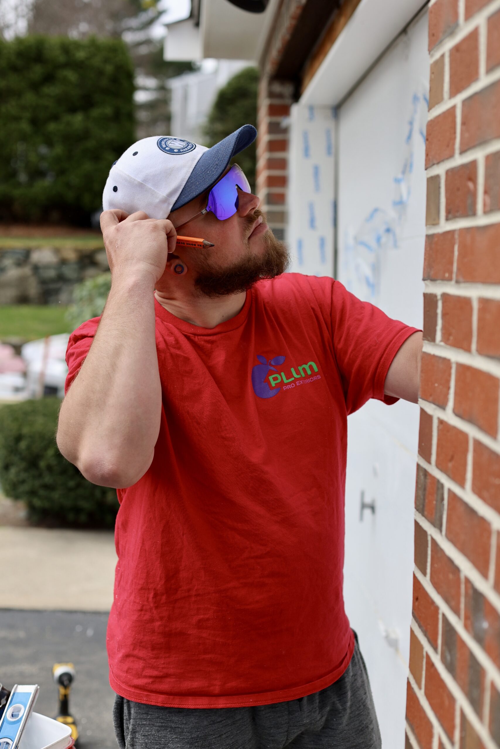 Installer checking a window opening before installation