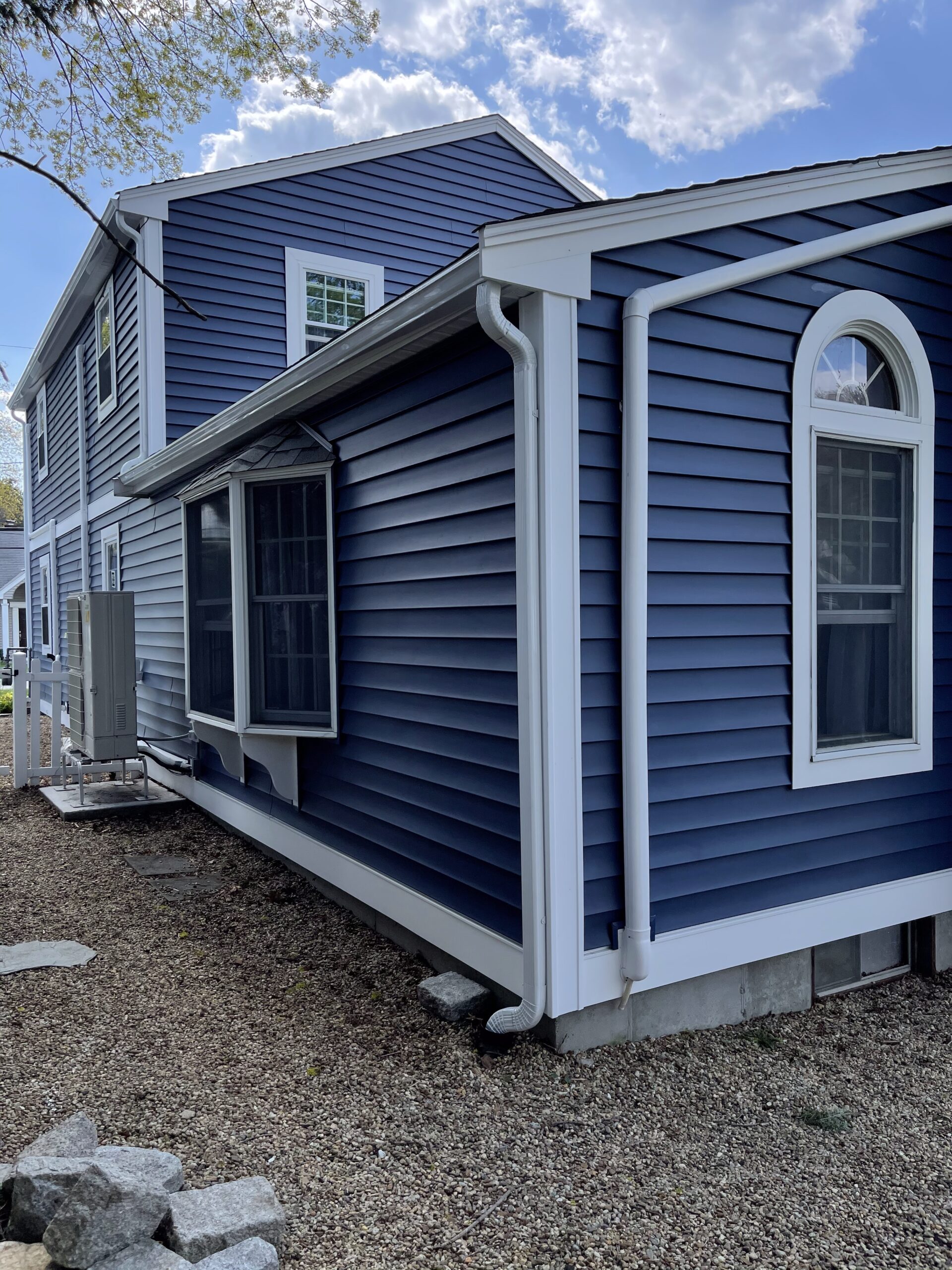 Downspouts around a bay window