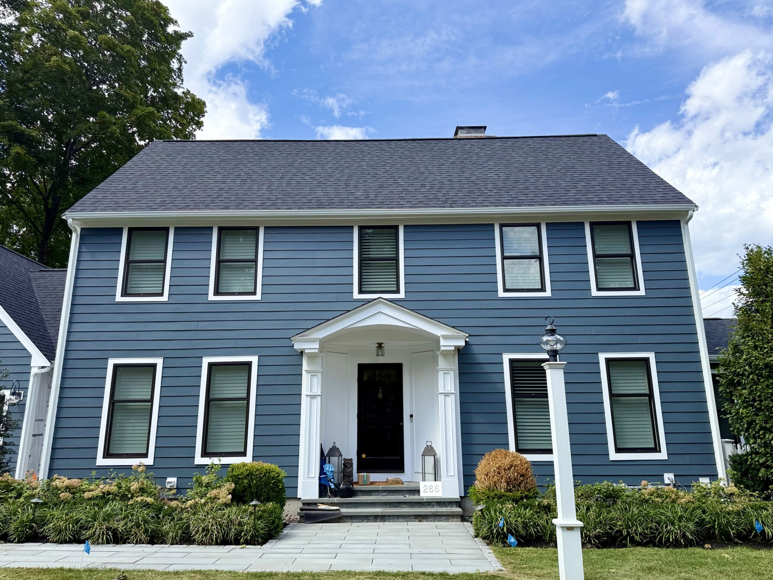 Colonial with a new CertainTeed roof and James Hardie siding